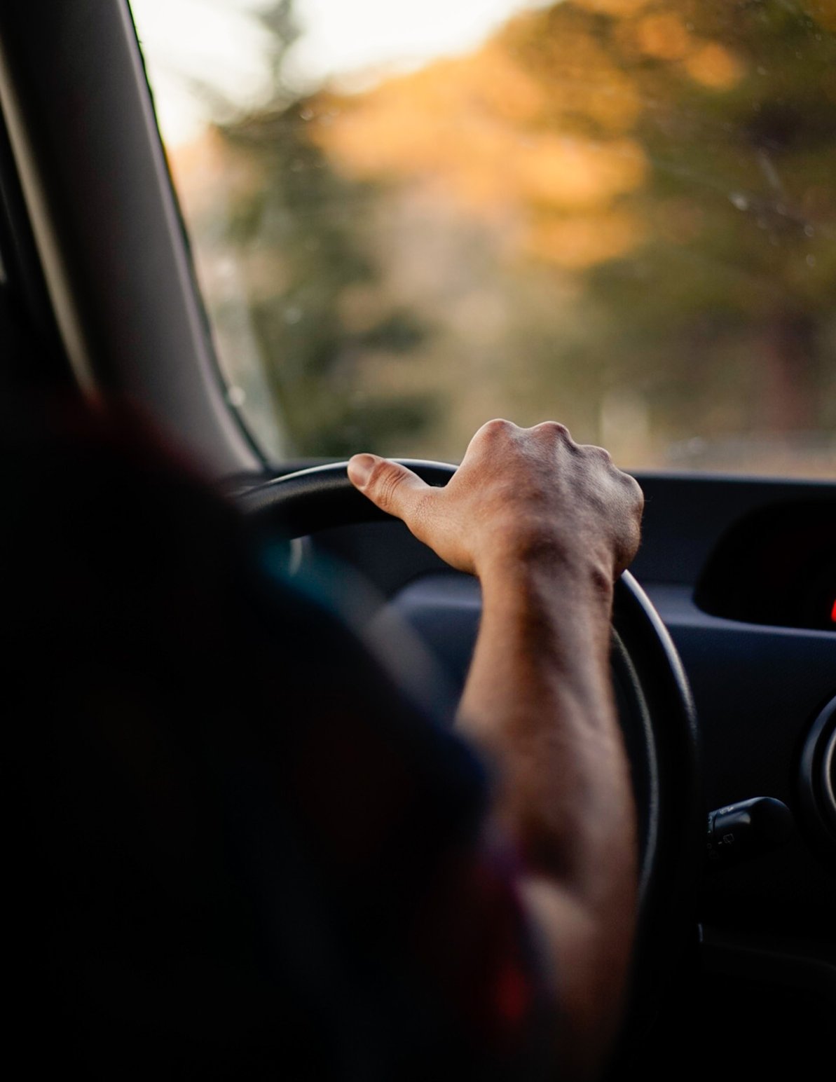 hand on a steering wheel hand on a steering wheel
