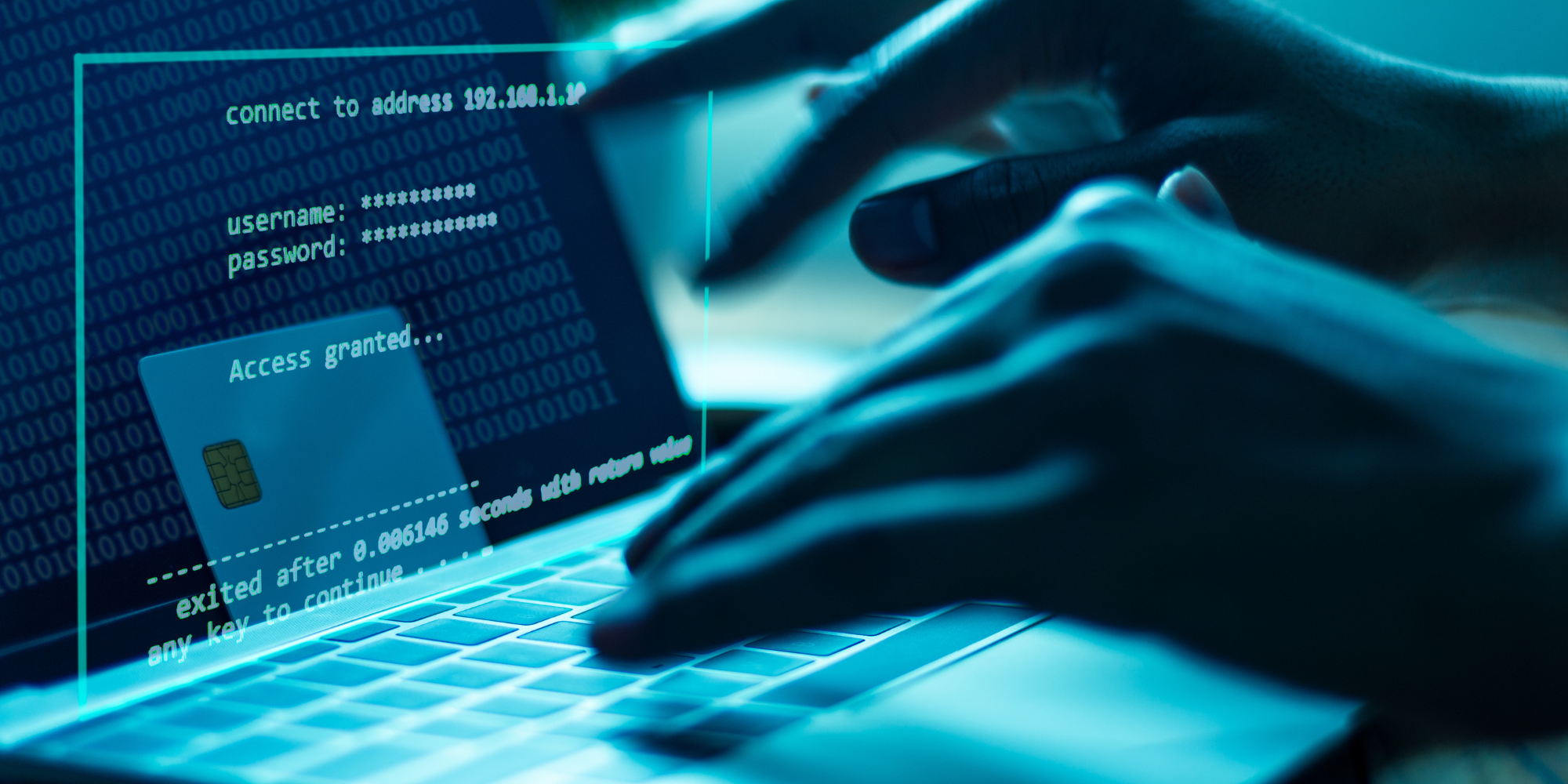 A close-up shot of hands typing on a laptop, logging into a high security network.