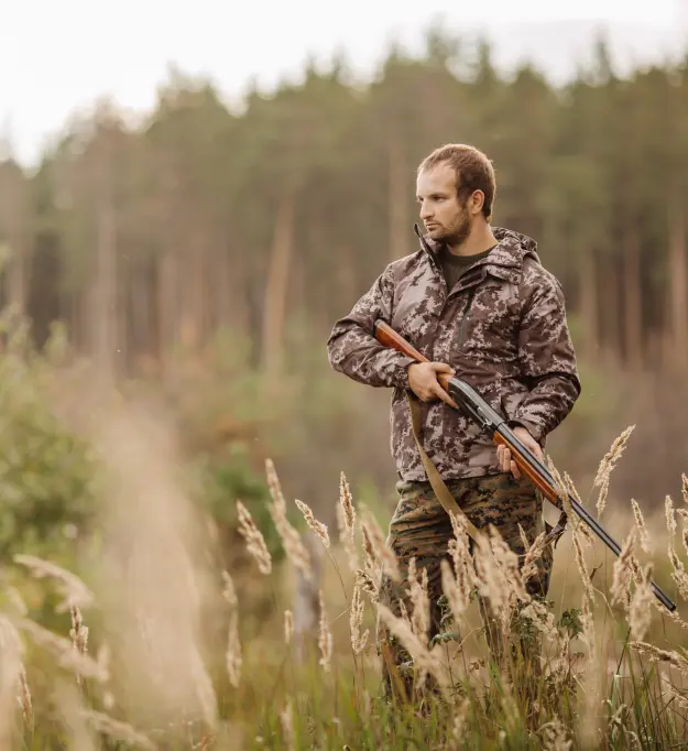 Hunter holding a shotgun